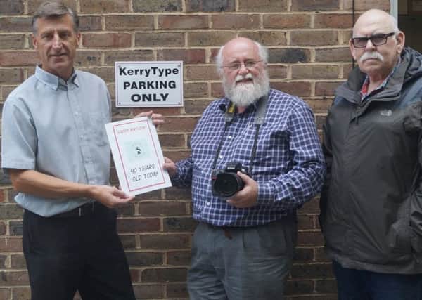 Darren Clarke of club sponsors Kerry Type presents 40th birthday greetings to club chairman Peter Jones
