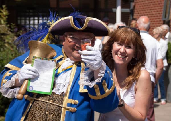 Worthing town crier, Bob Smytherman, with QAHH head of fundraising, Elizabeth Baxter. Picture credit: John Young Photography
