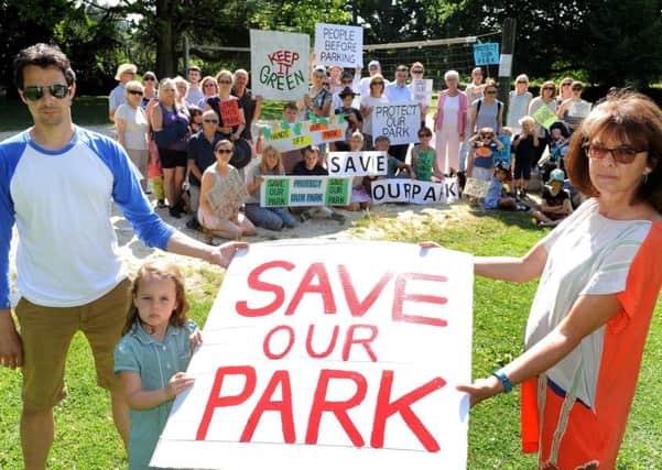 Sally Sanderson (right) and other residents protesting about plans to concrete over the volley pitch at Horsham Park. Pic Steve Robards SR1716819 SUS-170718-140027001