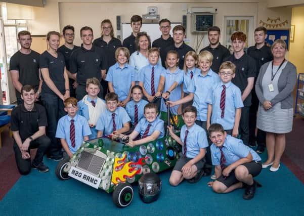 March CE Primary School students with their car and Rolls-Royce staff
