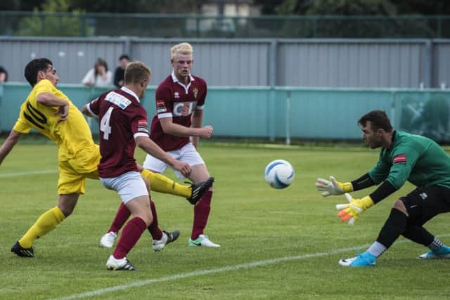 Dave Herbert pounces for Chichester City / Picture by Tommy McMillan
