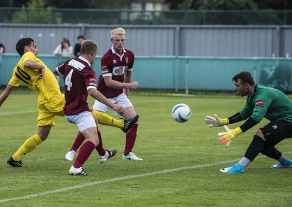 Dave Herbert pounces for Chichester City / Picture by Tommy McMillan
