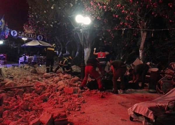 Firefighters and rescuers clear a road after an earthquake on the Greek island of Kos Picture: (Kostoday.gr via AP)/Press Association