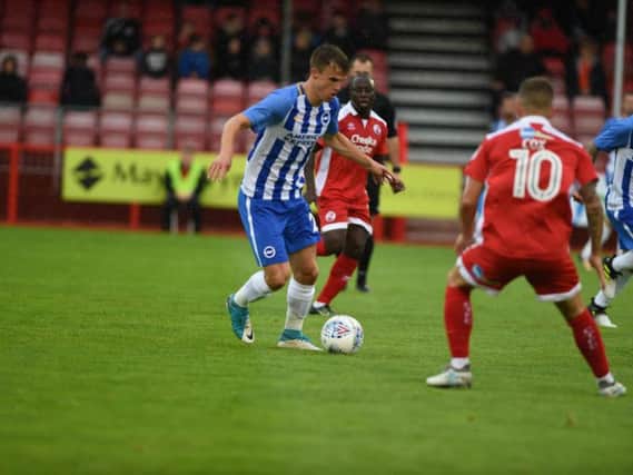 Goalscorer Solly March in action from Brighton & Hove Albion against Crawley Town