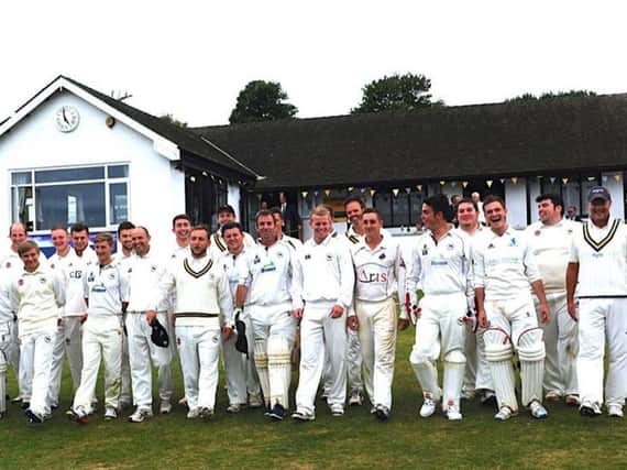 Past and present players take to the field for the anniversary celebration match. Picture by Stephen Goodger