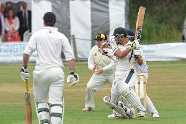 Action from the celebration 20-over match, which was eventually beaten by the weather. Picture by Stephen Goodger