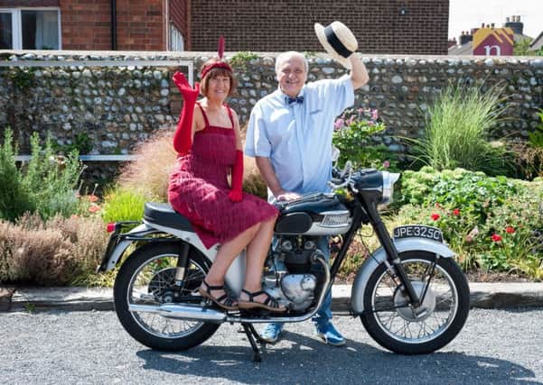 Julie Roby from Wick Village Traders Association and Roger Arthur from Going Spare, a business in Wick Village, with a 1965 Triumph Speed Twin 500 motorcycle. The motorcycle will be on display at the event, along with other vehicles. Picture: Scott Ramsey