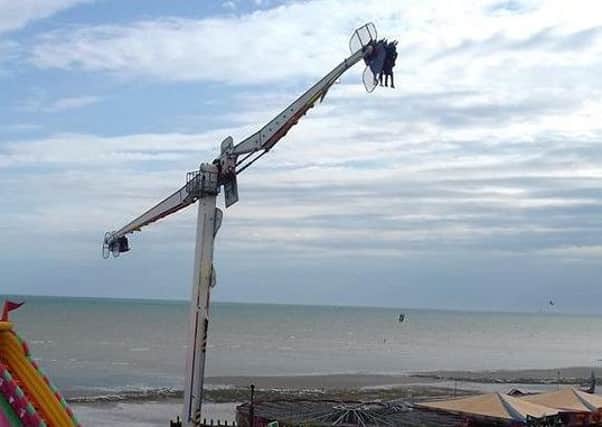The two boys were suspended in mid air but were not in any danger, the ride owner said as they were safely lowered down. Picture: Dale Overton
