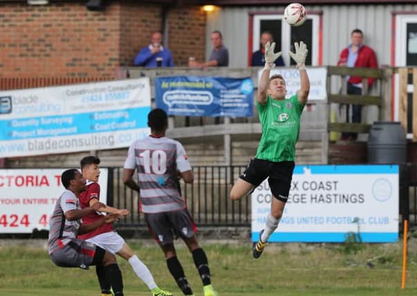 Hastings United goalkeeper Josh Pelling gathers a high ball into the box during Saturday's 4-0 win at home to Kingstonian. Picture courtesy Scott White
