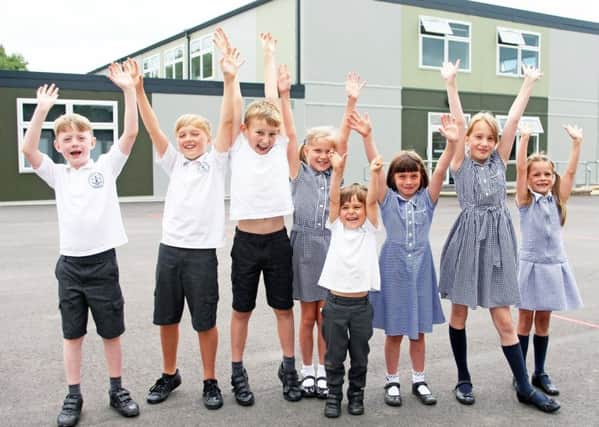 Pupils celebrate the opening of the new block