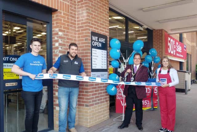 Billy cutting the ribbon at the Wickes reopening