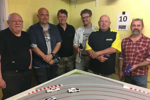 East Worthing Scalextric Club meets on the second and fourth Wednesday of the month at East Worthing Community Centre in Pages Lane. Far left is John Watts, 70, second from left is Darren McHarg, 41, and second from right is Terry Smith, 61
