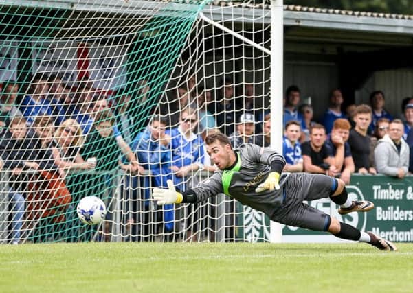 Dan Lincoln gets down to save a shot in the recent Pompey friendly / Picture by Tim Hale