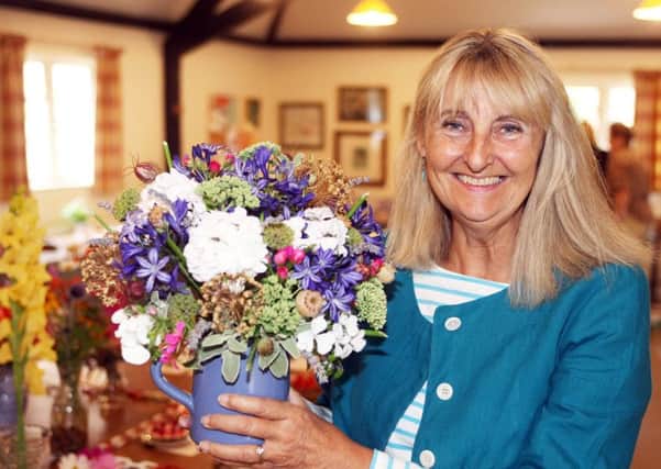 Caroline Douglas won the Heather Rose Bowl for the flowers section at Stedham with Iping Horticultural Societys annual flower show. Picture: Derek Martin DM17737510a