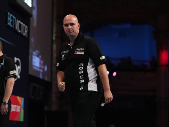 Rob Cross at the oche during his high class match against Adrian Lewis. Picture courtesy Lawrence Lustig, PDC