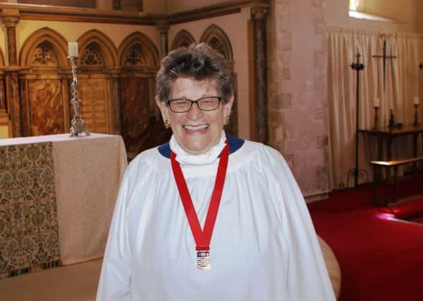 Ros Golds wearing her Royal School of Church Music long-service medal