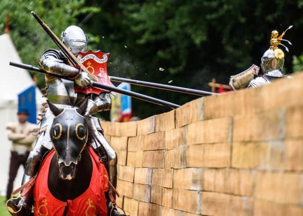 Stacy Van Dolah-Evans for Kingdom of England meets Piotr Rydzewski for Kingdom of Poland on Tuesday, the first day of the Arundel International Joust Tournament week at Arundel Castle. Picture: Julia Claxton