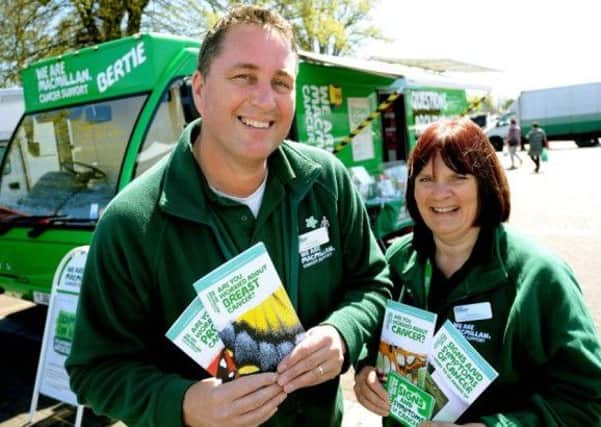 Facilities officer Phil Warner and information specialist Elaine Perry with Bertie, the Macmillan mobile information bus