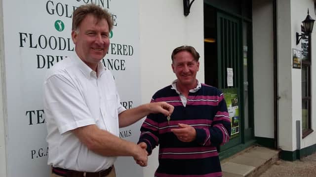 Outgoing Beauport Park Golf Club proprietor Charles Giddins (left) hands over the keys to his successor, Chris Hawes.