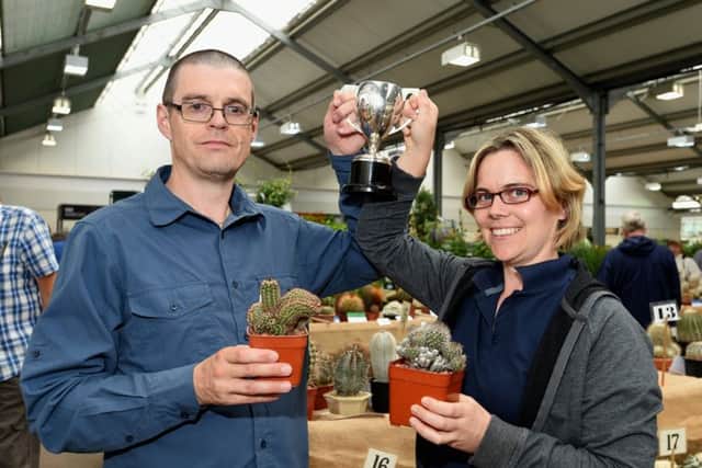 Sussex branch of British Cactus & Succulent Society Show.
Pictured are L-R Chris Haysom and Vicky Davies with their cacti and their Novice Cup. 
South Downs Nurseries, Hassocks, West Sussex. 
Picture: Liz Pearce 22/07/2017

LP170319 SUS-170722-192707008
