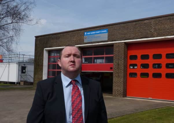 Michael Jones, Labour county councillor outside Crawley Fire Station