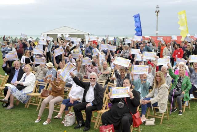Pictured at the seafront in Hove are the Peoples Postcode Lottery winners from postcode BN3 5 receiving their winner's cheques.  All pictures cleared for release.  Pictures Copyright Darren Casey / DCimaging 07989 984643 Peoples Postcode Lottery