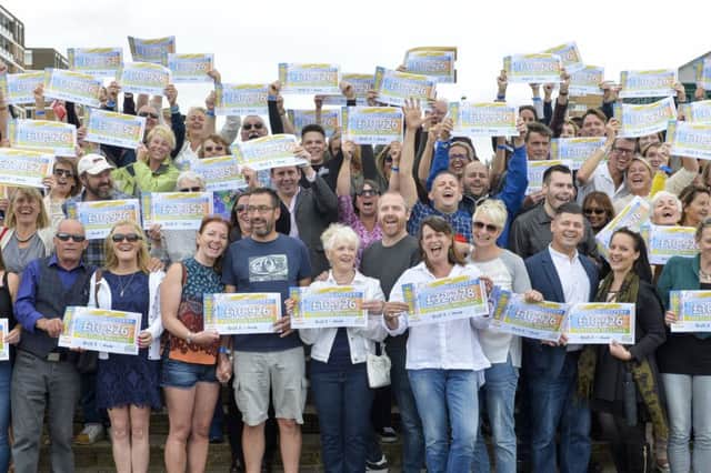 Pictured at the seafront in Hove are the Peoples Postcode Lottery winners from postcode BN3 5 receiving their winner's cheques.  All pictures cleared for release.  Pictures Copyright Darren Casey / DCimaging 07989 984643 Peoples Postcode Lottery