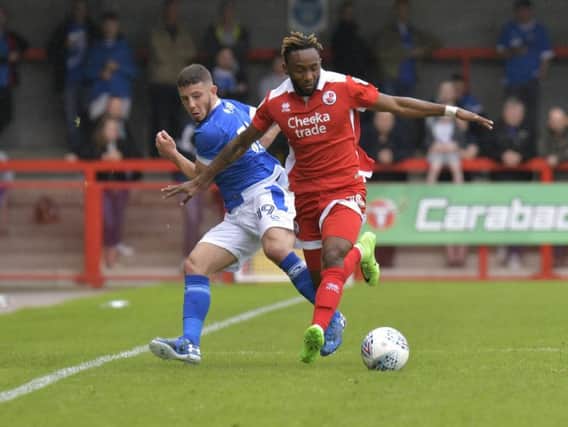 Crawley full-back Cedric Evina wins possession in this afternoon's friendly with Portsmouth. Picture by Neil Marshall