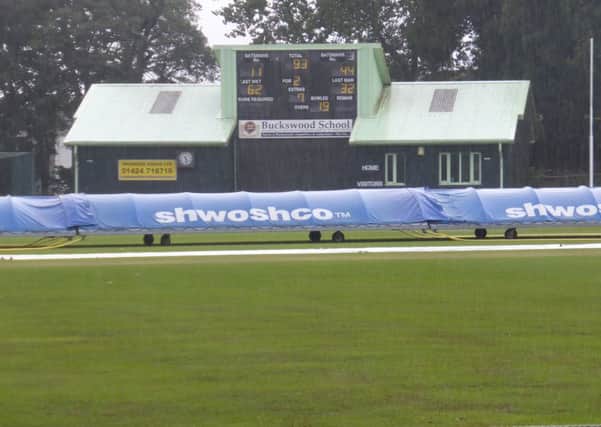 The covers are on and the rain is lashing down as Hastings Priory's match at home to Cuckfield at Horntye Park is abandoned. Picture by Simon Newstead