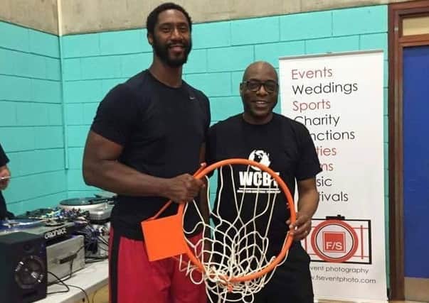 Jason Hannibal, of the NBA's Washington Wizards, with World Club Basketball Tournament founder Eric Douglin.