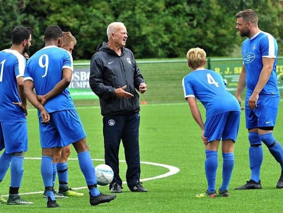 Shoreham Football Club manager Sammy Donnelly (centre). Picture by Stephen Goodger