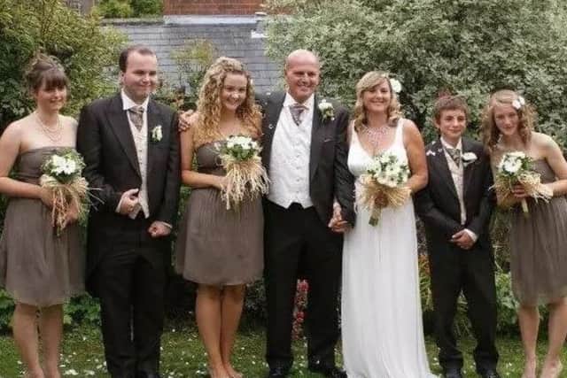 Paul and Millie with their children on their wedding day