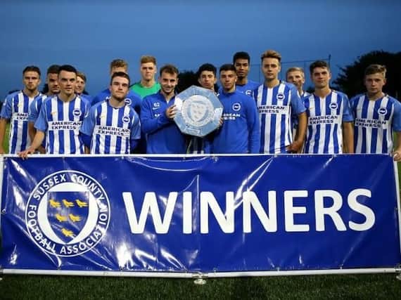 Albion under-23s with the Sussex Community Shield trophy. Picture by Simon Roe