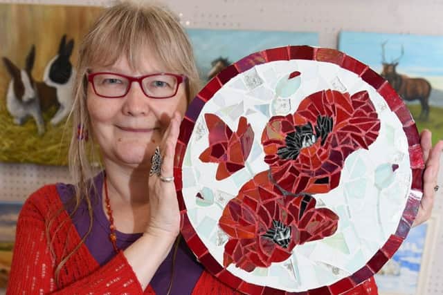 Deborah Fleming with her Red Poppies glass mosaic LP170657