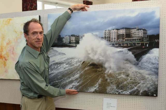Photographer David Curtis with his photo on canvas, Storm Wave - Brighton Seafront LP170658