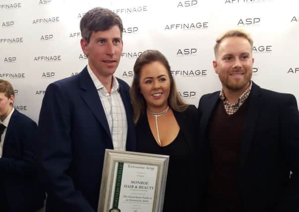 Good Salon Guide managing director Gareth Penn presents the award to Lisa Brady, with Tim Fluin, distributor account manager at Affinage Professional