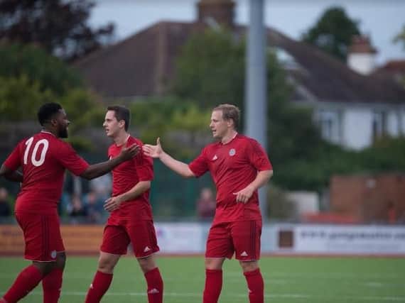 James Fraser (far, right) celebrates with another Worthing summer signing, Omar Folkes, in last night's friendly win. Picture by Marcus Hoare