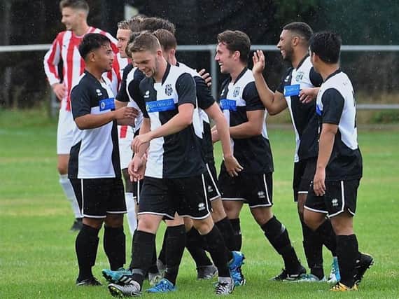East Preston players celebrate a goal in pre-season. Picture by Stephen Goodger