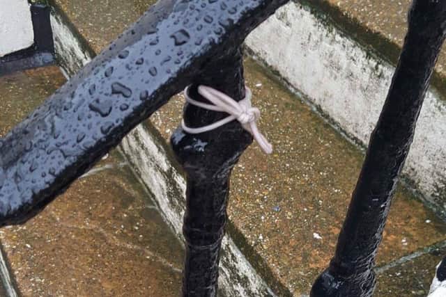 A hair tie on some railings in Hove (Photograph: Ash Mitchell)