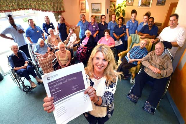 Residents and staff celebrate Woodside Hall's CQC result