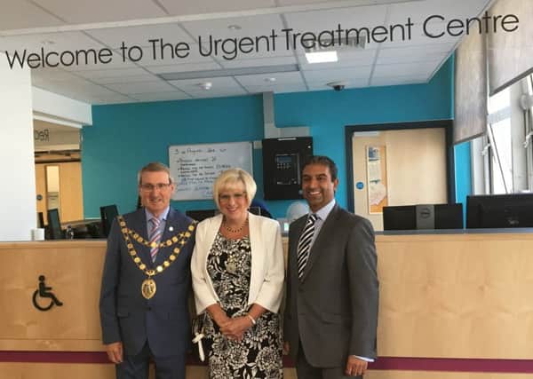 Crawley mayor Brian Quinn with his wife Sue and Dr Ketan Kansagra of the Crawley Clinical Commissioning Group at the official opening of Crawley Hospital's revamped Urgent Treatment Centre SUS-170408-113856001