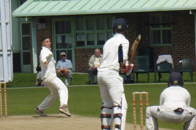 Jed O'Brien on his way to four wickets for Priory against Preston Nomads.