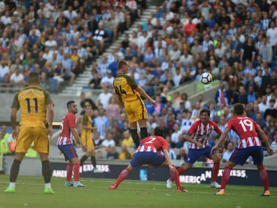 Steve Sidwell heads home Albion's second goal against Atletico Madrid. Picture by PW Sporting Pics