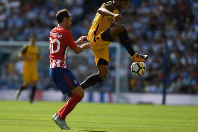 Izzy Brown gets to the ball ahead of Juanfran. Picture by Phil Westlake (PW Sporting Photography)