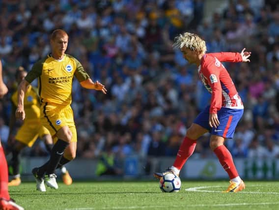 Steve Sidwell closes down Antoine Griezmann. Picture by Phil Westlake (PW Sporting Photography)