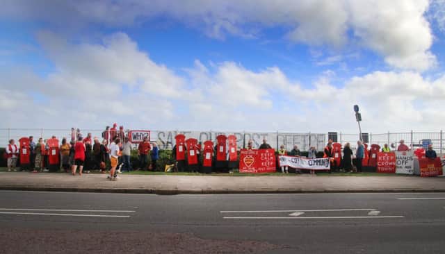 Hundreds lined the seafront to protest. Picture by Roberts Photographic SUS-170708-111742001