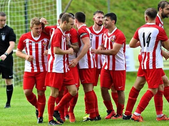 Steyning players celebrate after netting on Saturday. Picture by Stephen Goodger