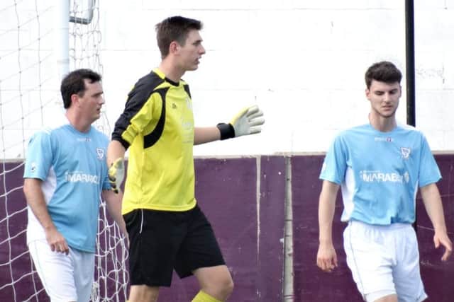 Bexhill United trio Craig Ottley, goalkeeper Dan Rose and Connor Robertson. Picture courtesy Mark Killy