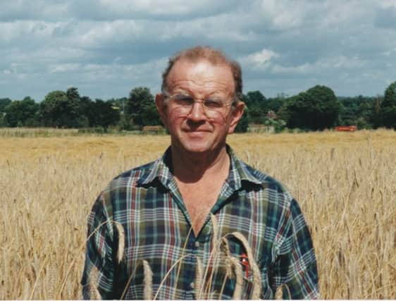 Keith Gadd pictured on his farm in front of a field of barley
