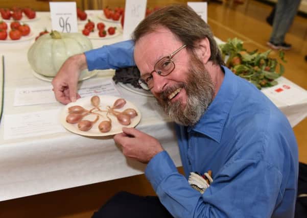 Alan Brooks winner best exhibit in the novice section with his shallots.
Picture: Liz Pearce 
LP170793